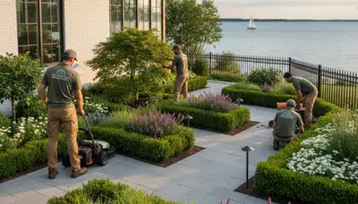 Detroit, MI landscaping service crew preparing a residential yard for lawn care and maintenance